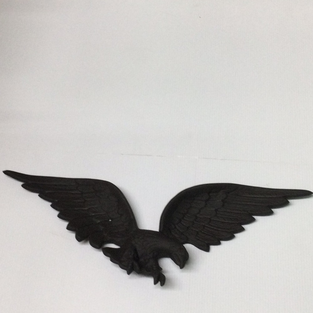 The Metal Eagle Hanging above The Garage Door